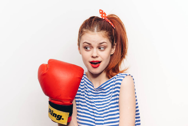 woman in boxing gloves striped t-shirt fun light background - Photo, image