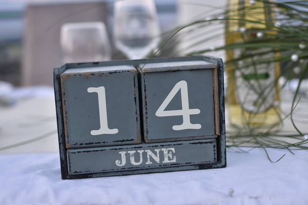 Wood blocks in box with date, day and month 14 June. Wooden blocks calendar - Photo, Image