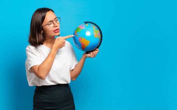 young pretty woman with a world globe map - Foto, Imagen