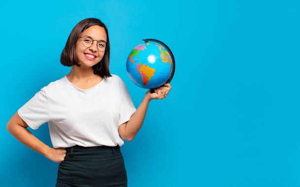 young pretty woman with a world globe map - Photo, image