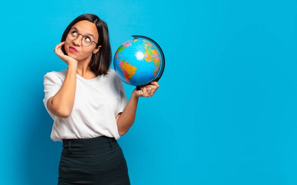 young pretty woman with a world globe map - Photo, image