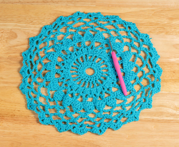 Crochet piece made of wool and knitted by hand cyan - Photo, Image