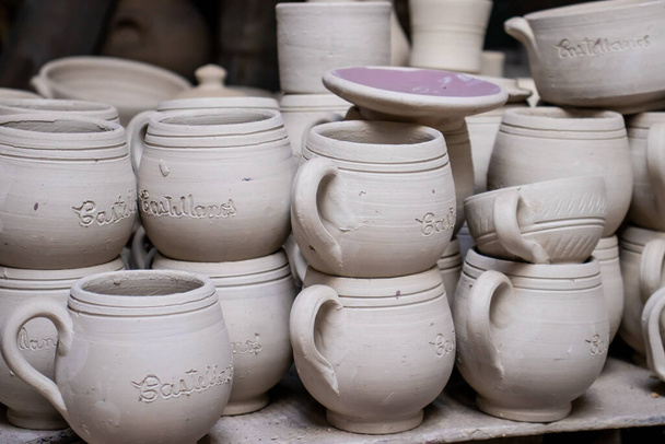 Ceramics on the elaboration process at a traditional factory at the beautiful small city of Raquira in Colombia - Photo, Image