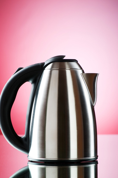 Shiny kettle against the colorful gradient background - Φωτογραφία, εικόνα
