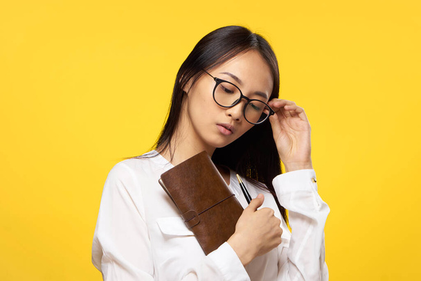 women with glasses notepad in the hands of an official office lifestyle - Zdjęcie, obraz