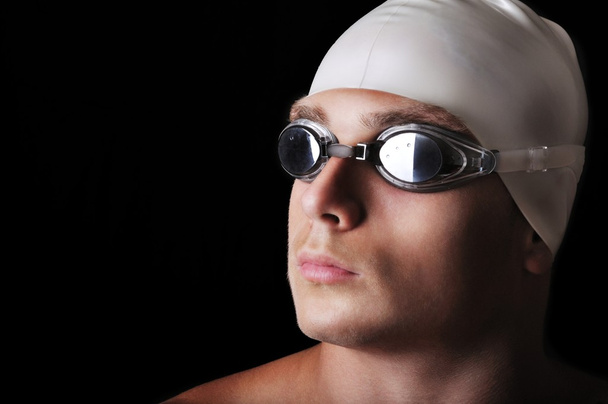 Male swimmer isolated on black - Foto, afbeelding