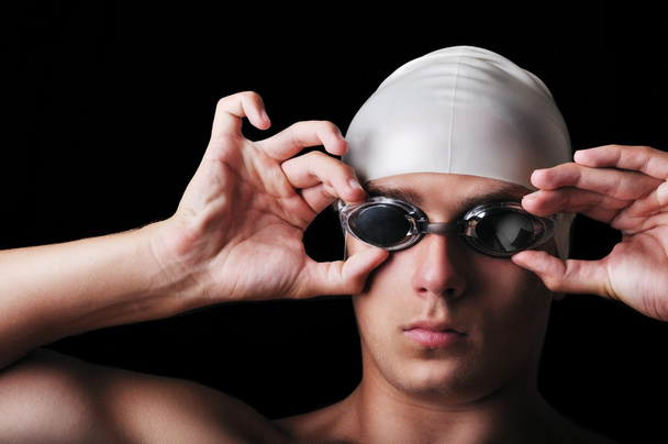Muscular male swimmer isolated on black - Φωτογραφία, εικόνα