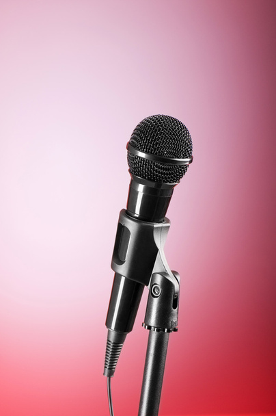 Black microphone against the colorful gradient background - Photo, Image