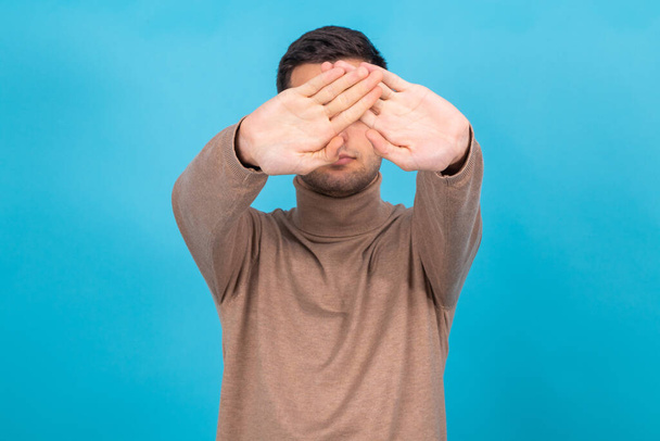 man isolated on background with hands covering face - Photo, Image