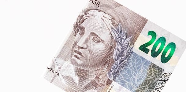 Real, money from Brazil. Dinheiro, Reais, Real Brasileiro, Brasil. Brazilian banknotes in close-up.  brazilian banknotes of 200 Reais   - Φωτογραφία, εικόνα