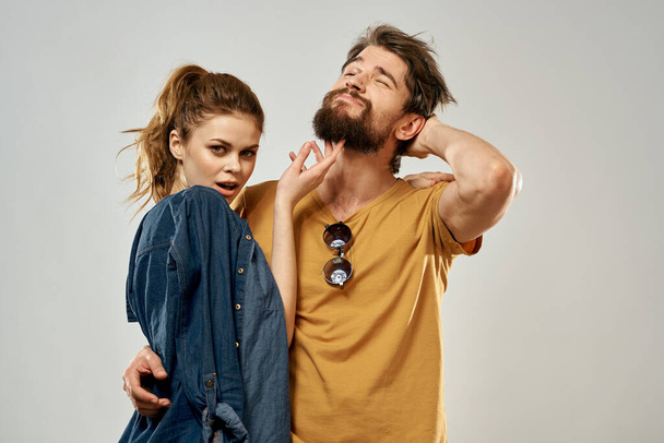 Young couple lifestyle emotions communication fashion light background - Foto, Imagen