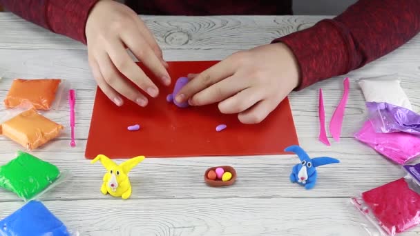 How to make an Easter bunny out of plasticine. Step by step instruction from the child. Step 1 - Footage, Video