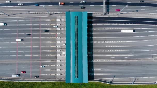 Toll roads on the broad highway. Through the point passes a large number of trucks and cars. Top down view from quadcopter - Footage, Video