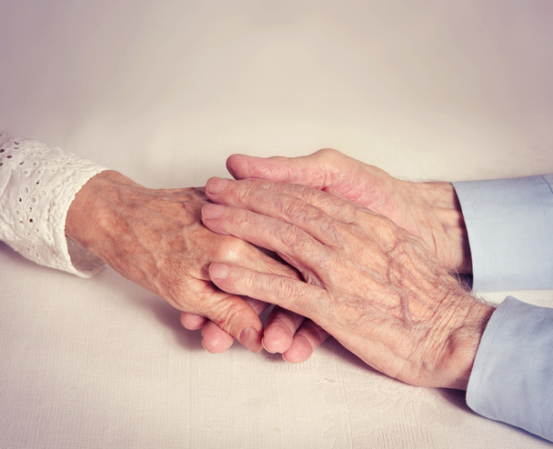 Old people holding hands closeup. - 写真・画像
