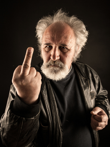 Grumpy man showing middle finger - Photo, Image