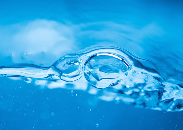 Blue water background with splashes and bubbles  - Photo, Image