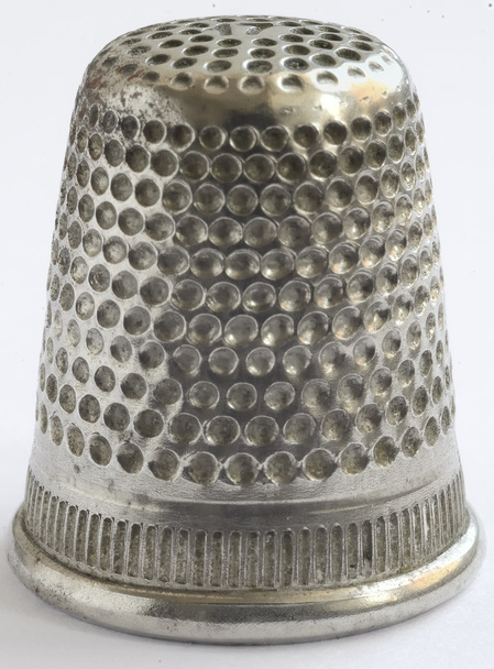 Close up a very old thimble, white background. - Photo, Image