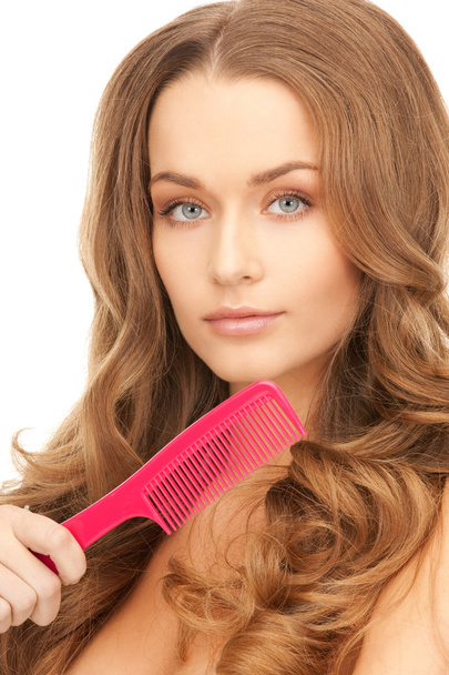 Beautiful woman with comb - Фото, изображение