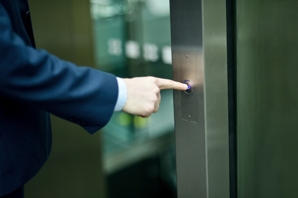 Hand pressing elevator button - Valokuva, kuva