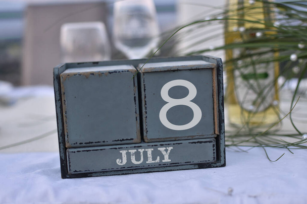 Wood blocks in box with date, day and month 8 July. Wooden blocks calendar - Photo, Image