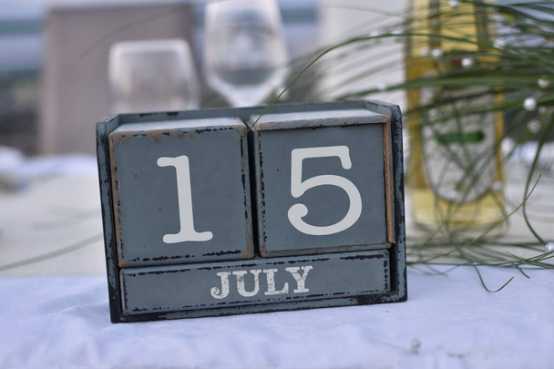 Wood blocks in box with date, day and month 15 July. Wooden blocks calendar - Photo, Image