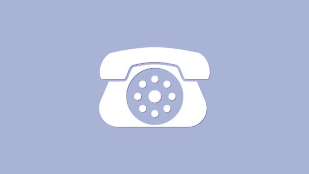 Biała ikona telefonu odizolowana na fioletowym tle. Telefon stacjonarny. 4K Animacja graficzna ruchu wideo - Materiał filmowy, wideo