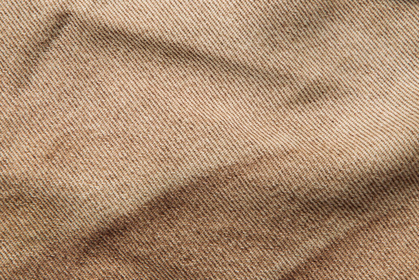tessuto grunge sfondo, vero cotone denim marrone, rugoso, sfilacciato, vicino - Foto, immagini
