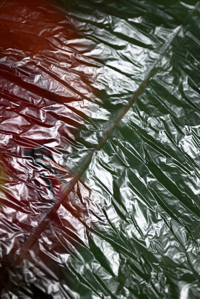 Bolsa de plástico cerca de fondo abstracto impresión moderna de alta calidad - Foto, Imagen