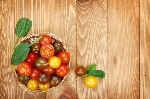 Cherry tomatoes on table - Фото, изображение