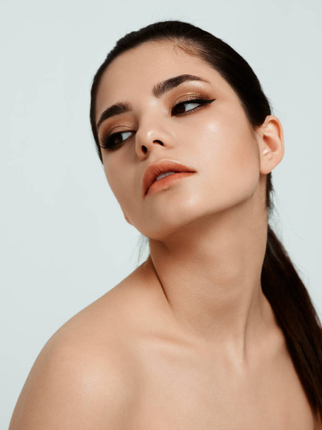 sexy brunette with evening makeup naked shoulders hairstyle cropped view - Zdjęcie, obraz