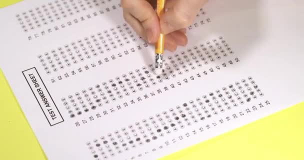 exam test. Filling in the test. Erase the wrong answer on the test form. - Footage, Video