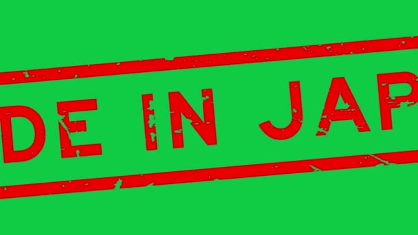 Grunge rojo made in japan word rubber seal stamp zoom on green background - Metraje, vídeo