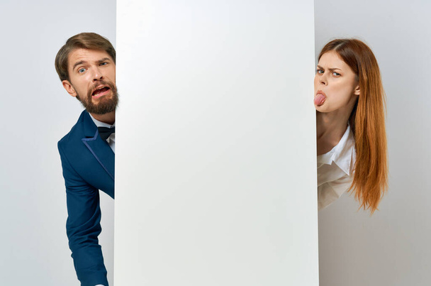 business man and woman emotions presentation white paper mockup Poster - Φωτογραφία, εικόνα