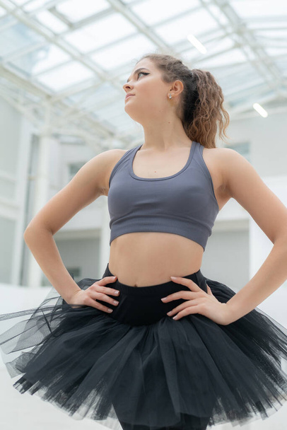 Beautiful flexible slender young girl ballerina. Ballet - Фото, изображение