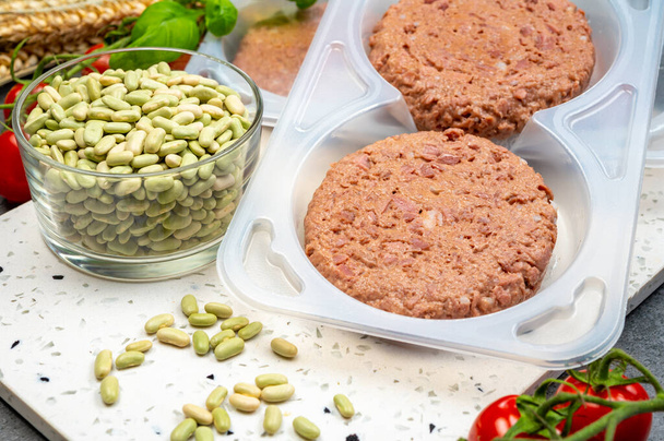 Healthy vegetarian vegan food, raw plant based soya beans burger ready to cook - Photo, Image