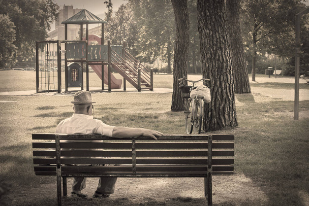 lonely old man, seniority concept (sepia vintage filter increases the loneliness effect) - Photo, Image