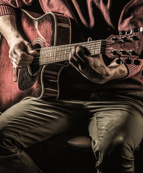 Male musician playing guitar, music instrument. Mans hands playing acoustic guitar, close up. Acoustic guitars playing. Guitars acoustic - Photo, Image