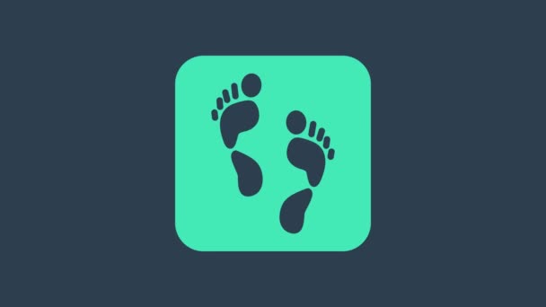 Türkiz Emberi lábnyom ikon elszigetelt kék alapon. Emberi láb nyomai. 4K Videó mozgás grafikus animáció - Felvétel, videó