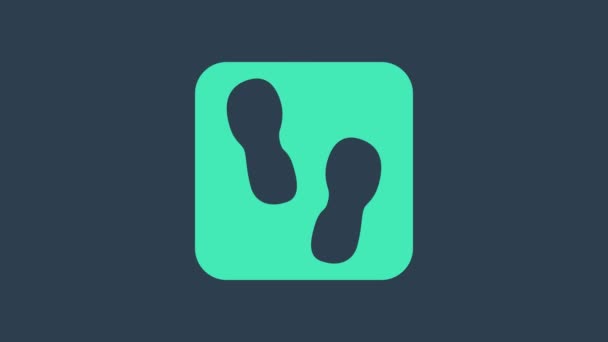 Türkiz Emberi lábnyomok cipő ikon elszigetelt kék alapon. Cipőtalp. 4K Videó mozgás grafikus animáció - Felvétel, videó