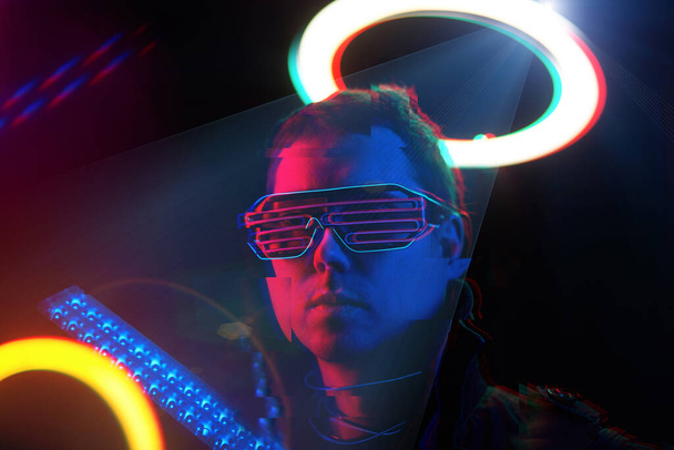 Cyberpunk style portrait of man in futuristic costume. Image with glitch effect. - Photo, Image