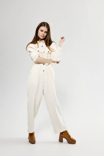pretty woman in white jumpsuit fashion clothes brown shoes - Photo, Image