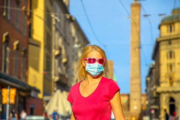 sunset with face mask in Bologna - Photo, Image