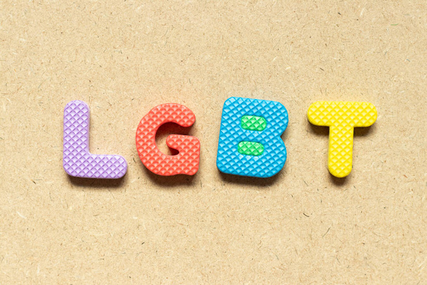 Foam alphabet letter in word LGBT (lesbian, gay, bisexual, and transgender) on wood background - Foto, immagini