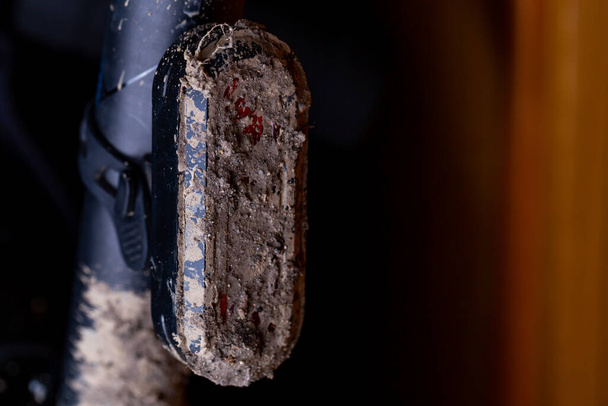 Extremely muddy and dirty bicycle rear light - Photo, Image