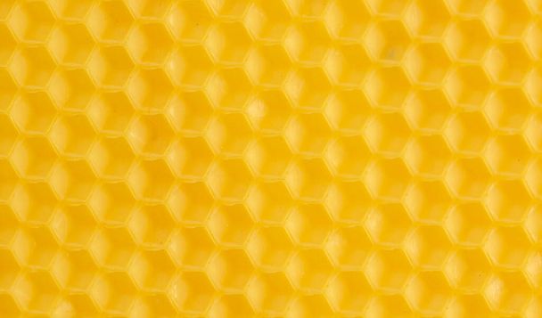マクロ写真抽象的な黄色の背景蜂の蜜蝋 - 写真・画像