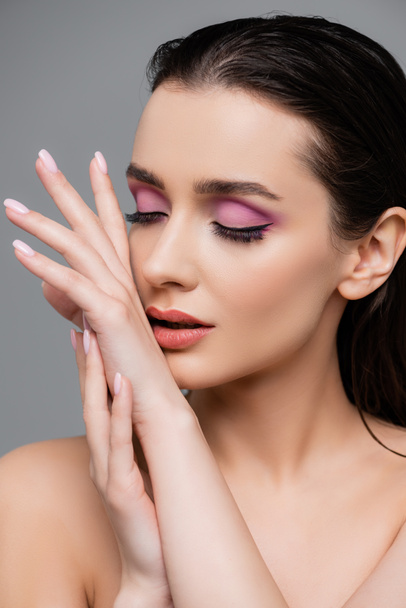 sensual woman with pink eye shadows isolated on grey - Foto, afbeelding