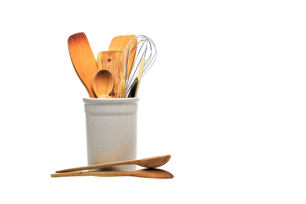https://cdn.create.vista.com/api/media/small/450864004/stock-photo-wooden-utensils-cooking-white-glass-kitchen-spoons-scoops-forks-isolated