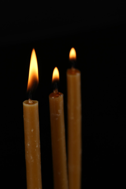 Burning candles on black background - Fotoğraf, Görsel