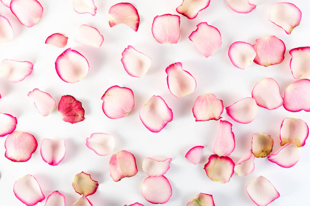 Lichte samenstelling van rozenblaadjes. Achtergrond van rozenblaadjes. Bovenkant. - Foto, afbeelding