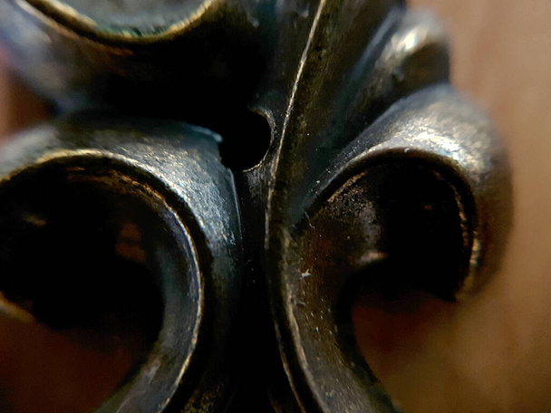Brass coatings seen very close of a book case handle - Photo, Image